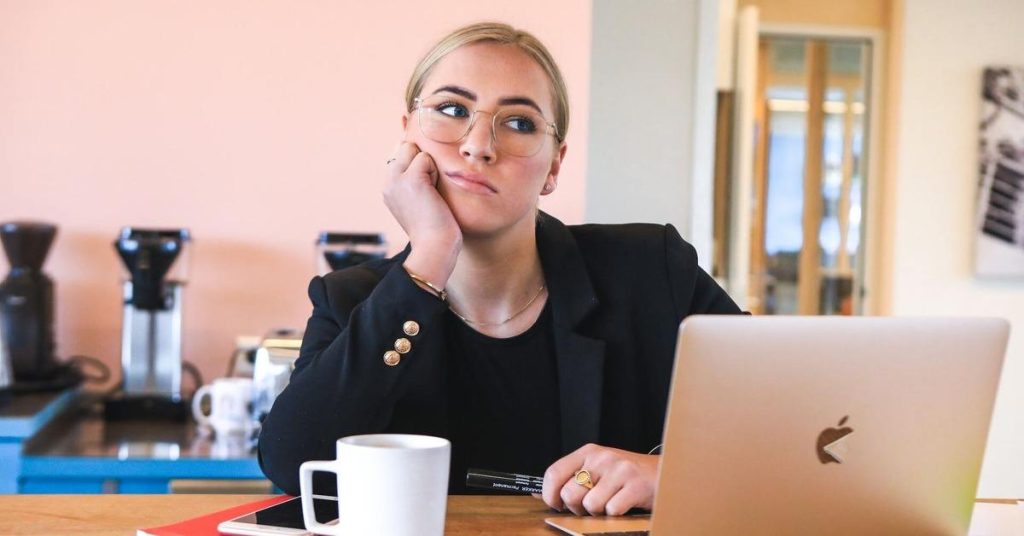 A woman thinking about rent vs buy.